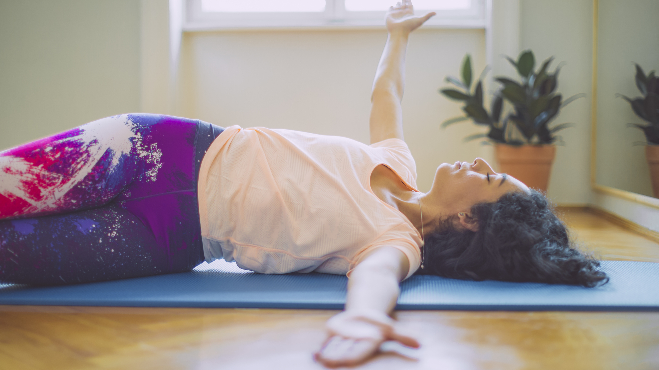 Woman stretching on mat
