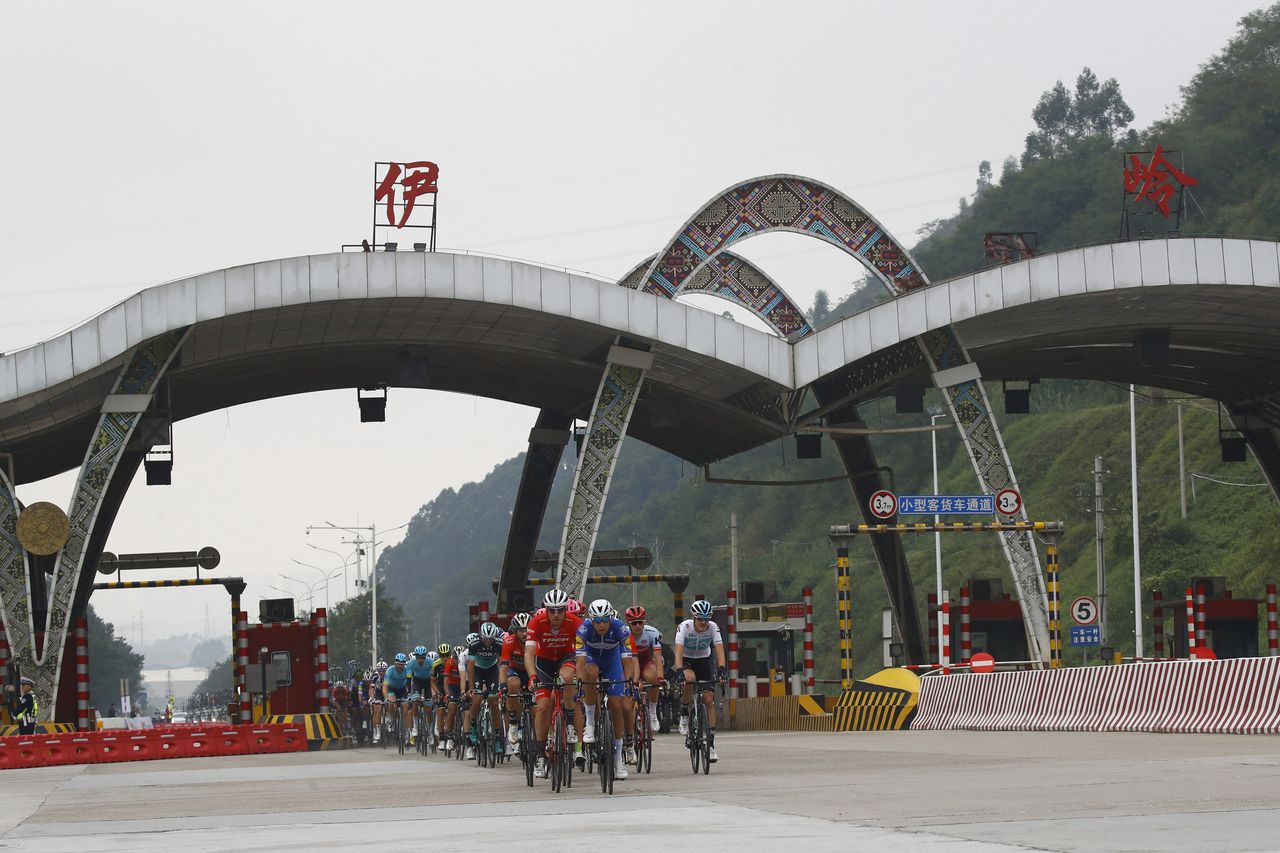 The Tour of Guangxi passes under a toll booth