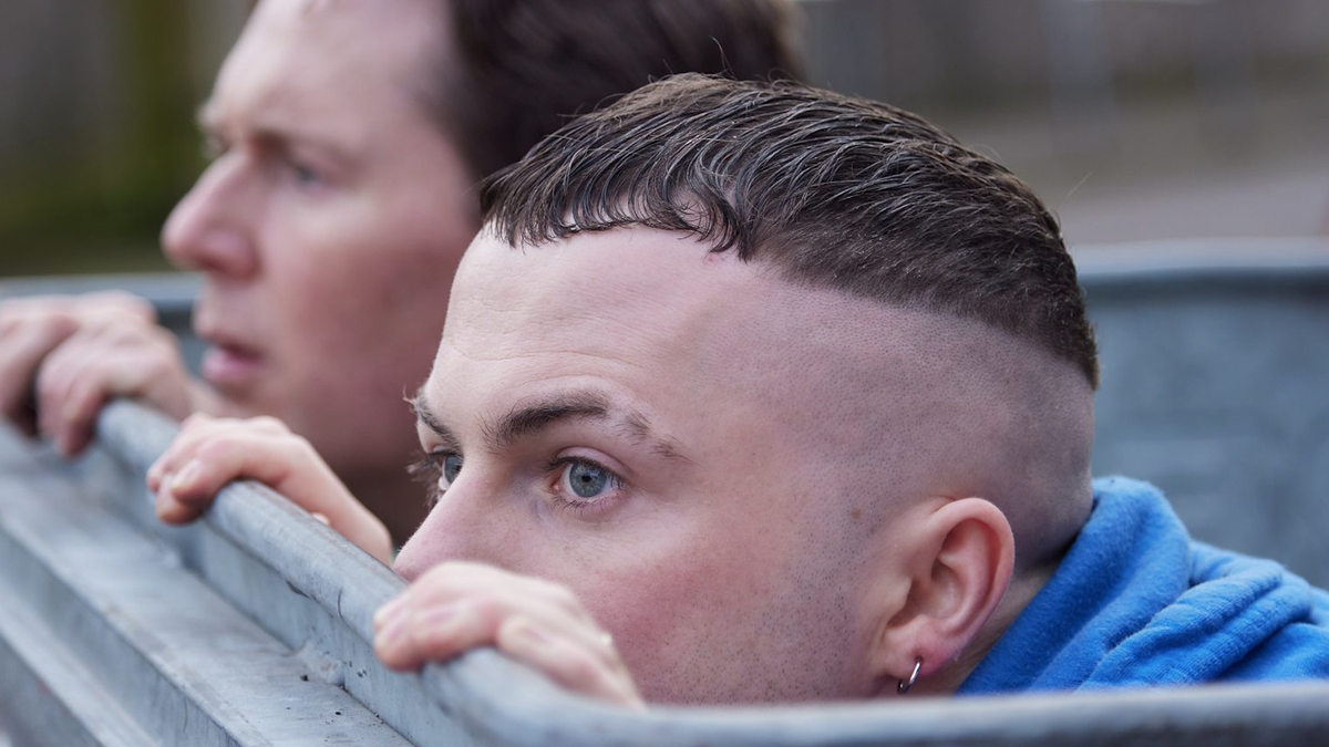 Billy Murphy (played by Shane Casey) and Conor MacSweeney (Alex Murphy) hiding in a waste bin in &quot;The Young Offenders&quot; Season 4