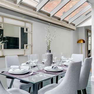 dining room with white walls and dining table with chairs
