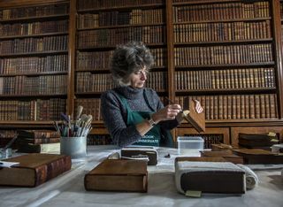 Caroline has huge skill in repairing books that need a little TLC. ©Mark Williamson / Country Life