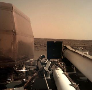 NASA's InSight Mars lander captured this view of its surroundings shortly after touching down on the Red Planet on Nov. 26, 2018.