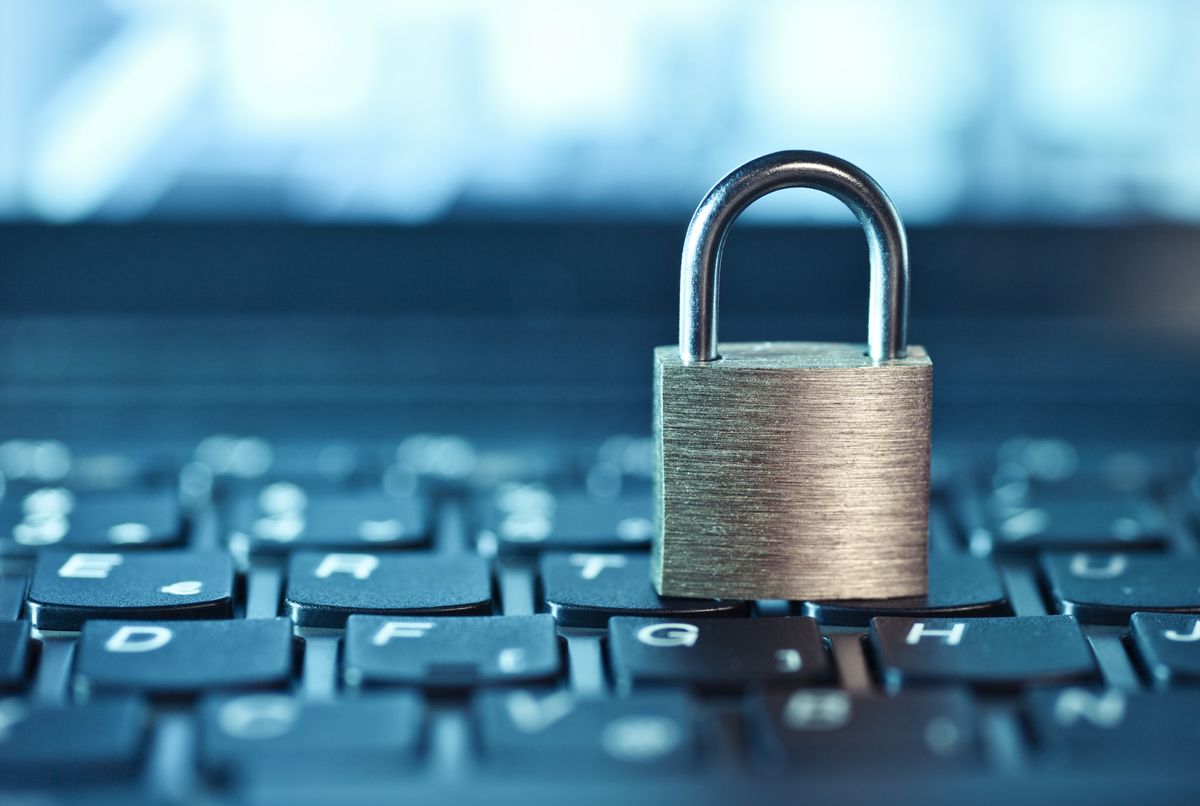 A padlock sitting on a laptop keyboard