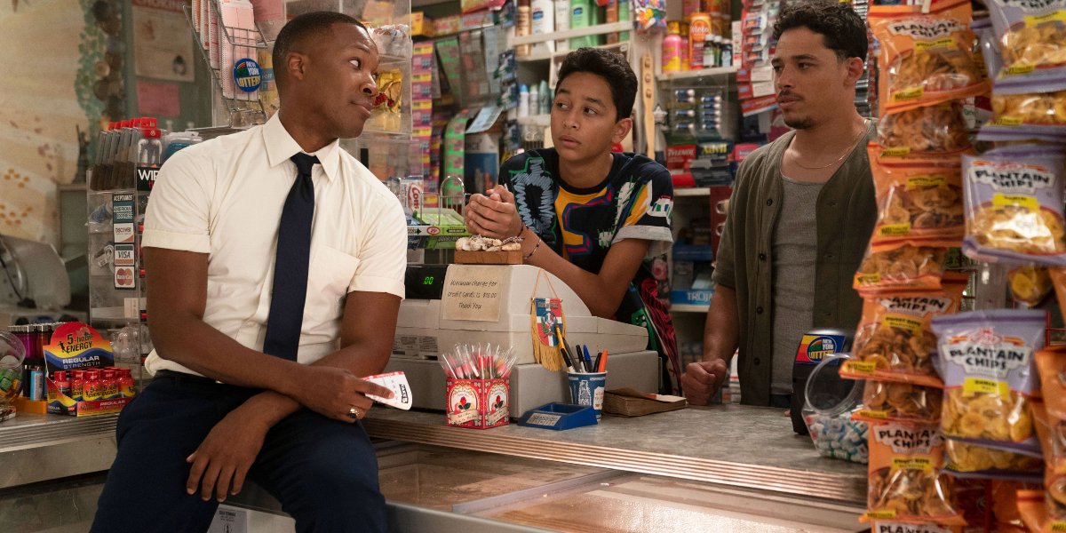 Corey Hawkins Gregory Diaz IV and Anthony Ramos hang out at the counter in In The Heights.