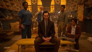 Loki sits on a bench surrounded by his TVA allies in Loki season 2