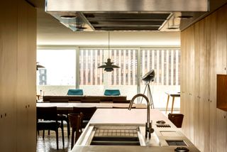 Saito Arquitetos updates apartment in modernist São Paulo building Kitchen dinning room
