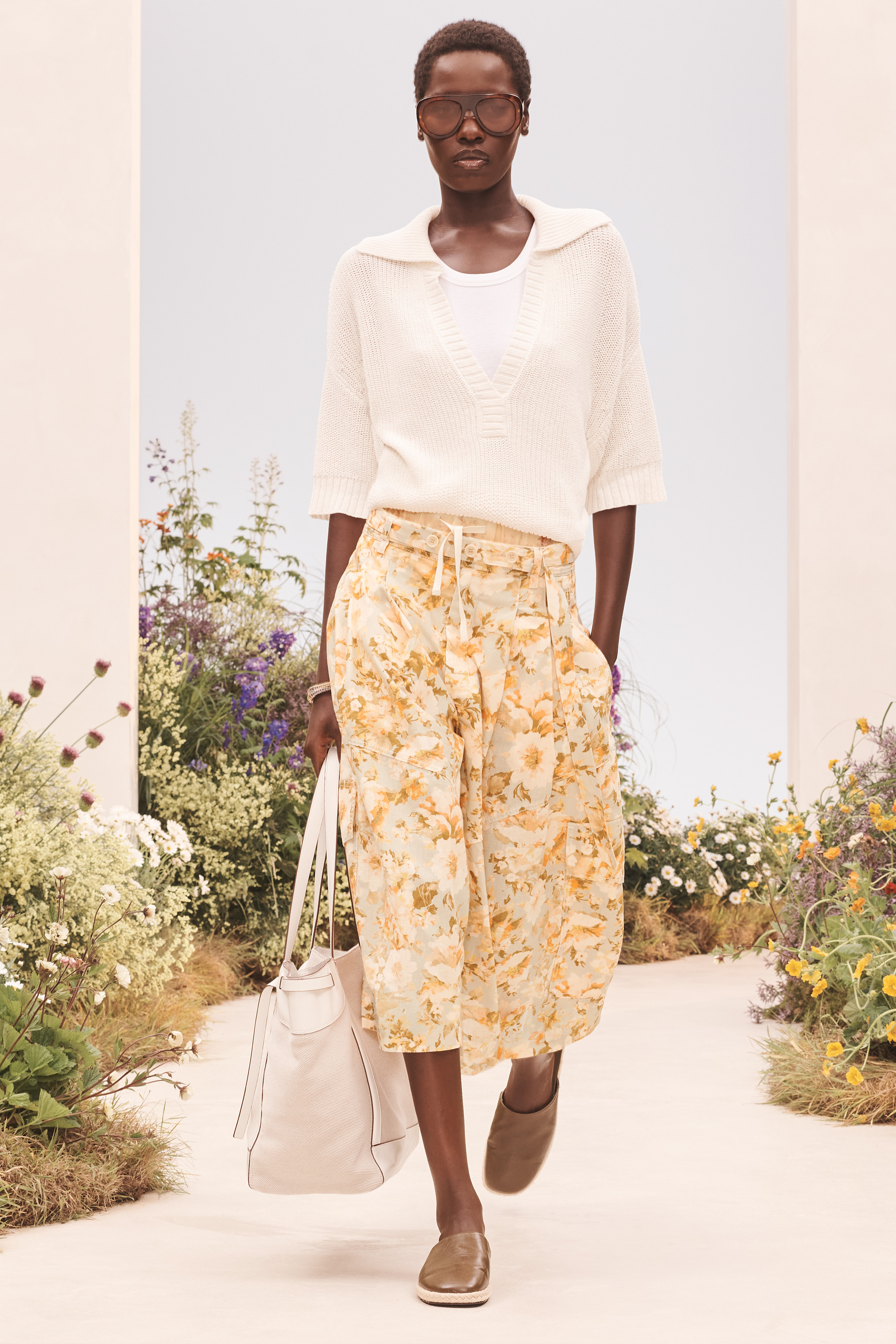 A model wearing a summer outfit from the Zara SRPLS FLWRS fashion collection