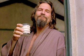 jeff bridges in his robe holding up a white russian in The Big Lebowski