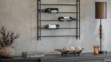 One.World wine rack mounted on wall above console