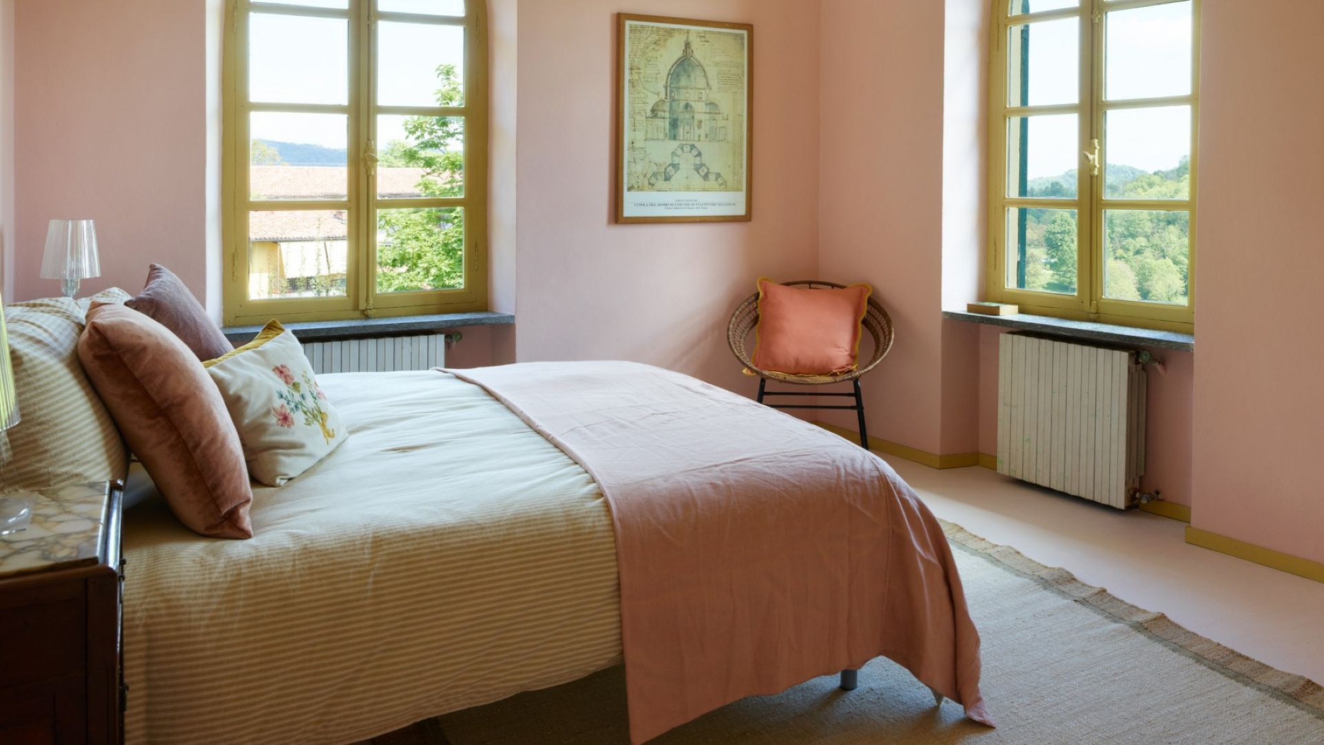 warm toned bedroom with throw, cushions and rug