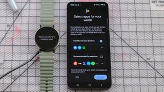 Samsung Galaxy Watch 7 next to a Samsung Galaxy S24 smartphone showing the app selection screen 