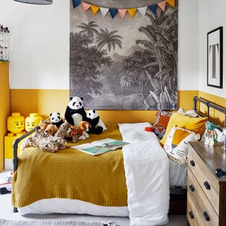 yellow kids' bedroom with wall hanging