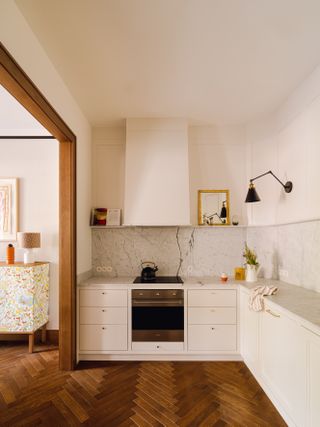 small cream kitchen in open plan apartment