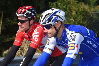 Nikolas Maes (left), in a 2017 Lotto Soudal jersey like the one available on eBay, chats to former teammate Tom Boonen at that year's Tirreno-Adriatico
