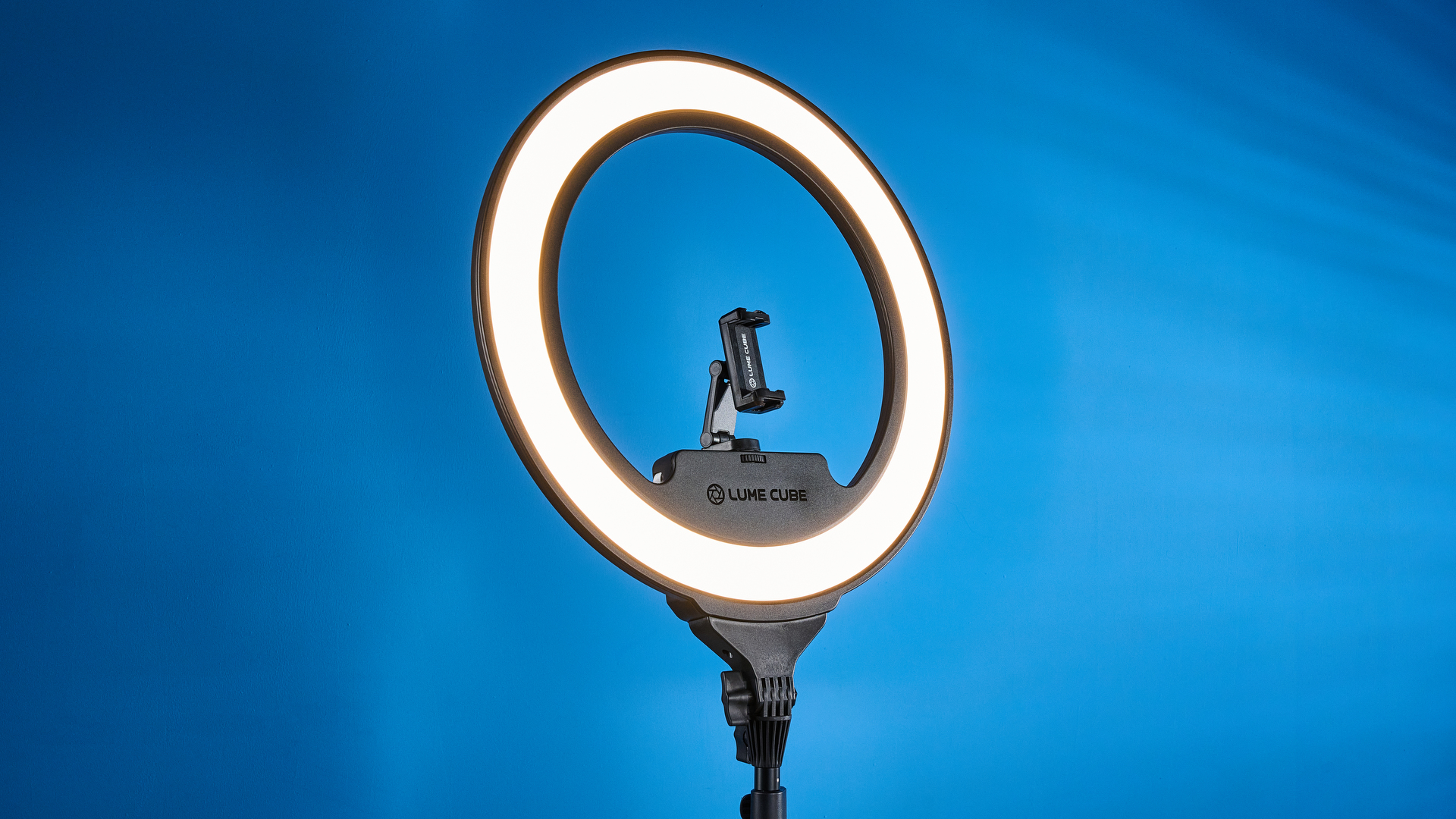 Lume Cube Cordless Ring Light Pro photographed in front of a blue background