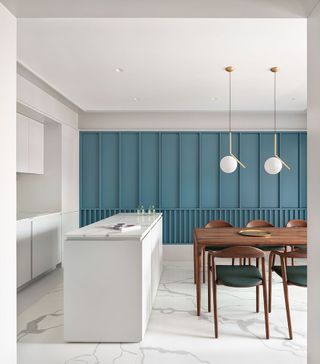 Blue panelling and marble floor in the kitchen