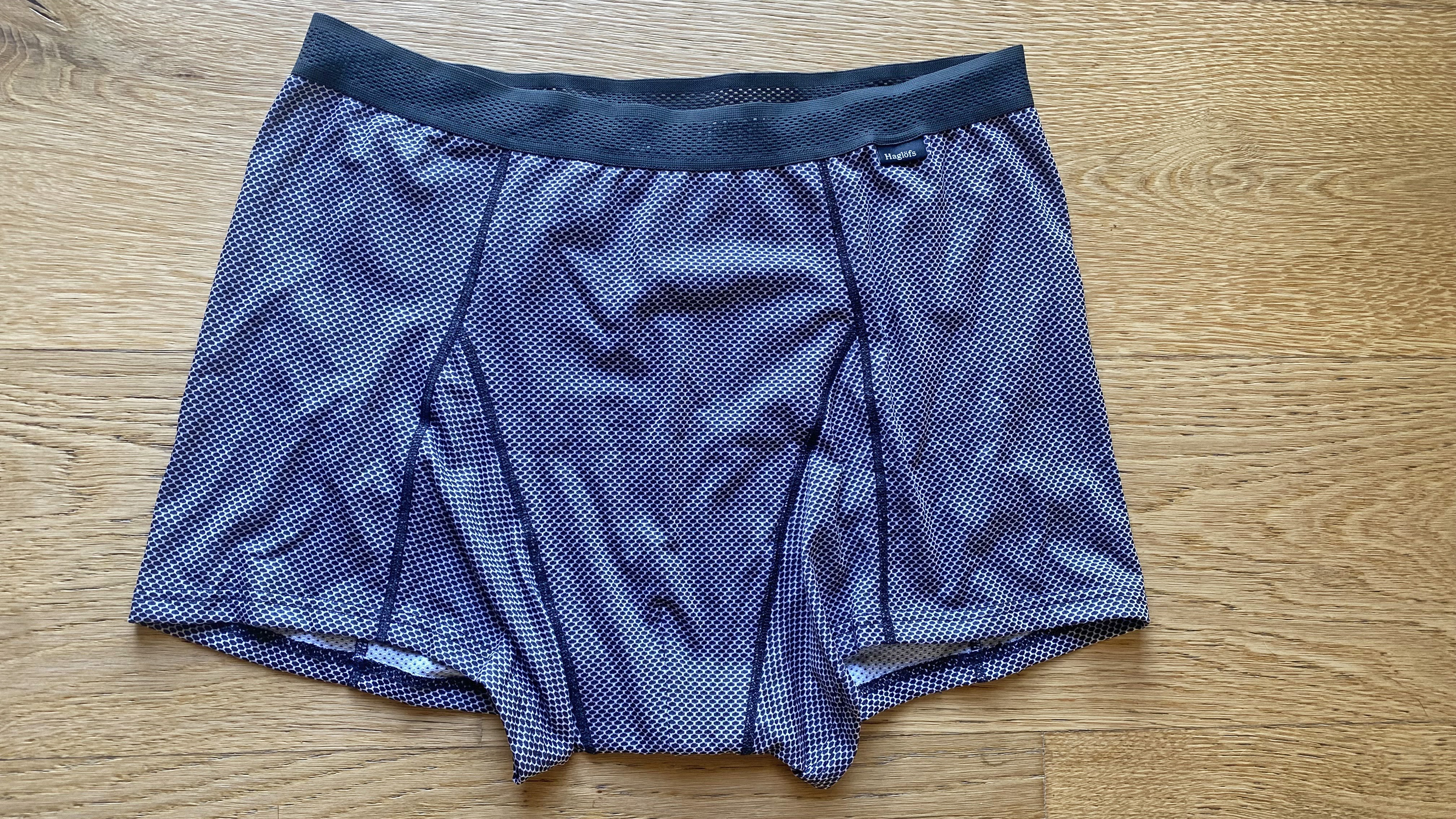 Front view of the Haglöfs L.I.M ZT II Air Bottom Men's boxer briefs laid on a wooden floor