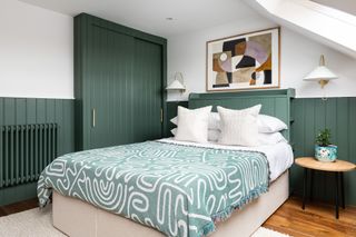 An in-built headboard painted in green