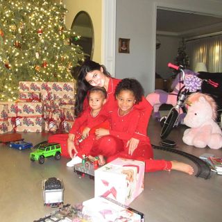 Kylie Jenner with her kids, Stormi and Aire, in a Christmas picture she shared to Instagram.