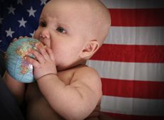 Baby with globe and American flag