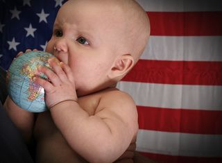 Baby with globe and American flag