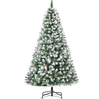 snow dusted artificial christmas tree