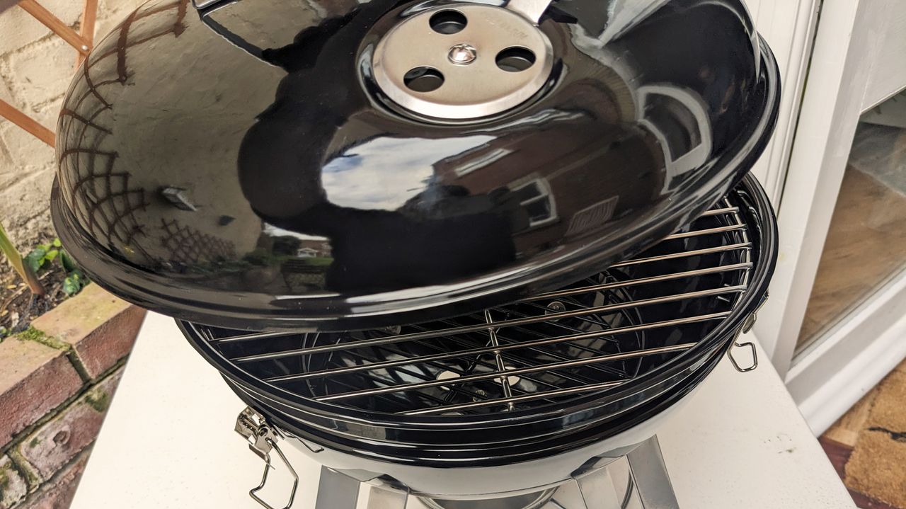 Napoleon NK14 Portable Charcoal Kettle Grill being tested in writer's home