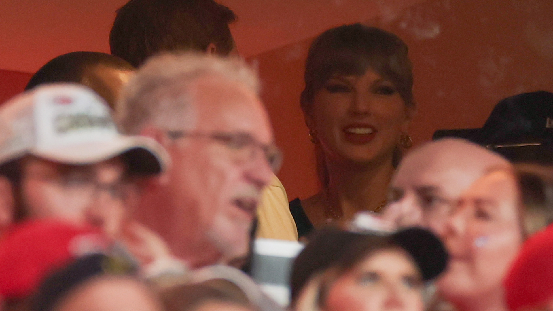 Taylor Swift wearing a custom jersey for the Kansas City Chiefs vs Detroit Lions football game