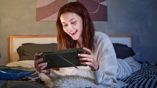Woman playing ASUS ROG Ally X.