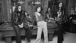Deep Purple posing on a pool table in 1975