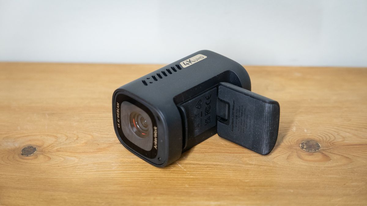 AnkerWork C310 webcam on a wooden surface