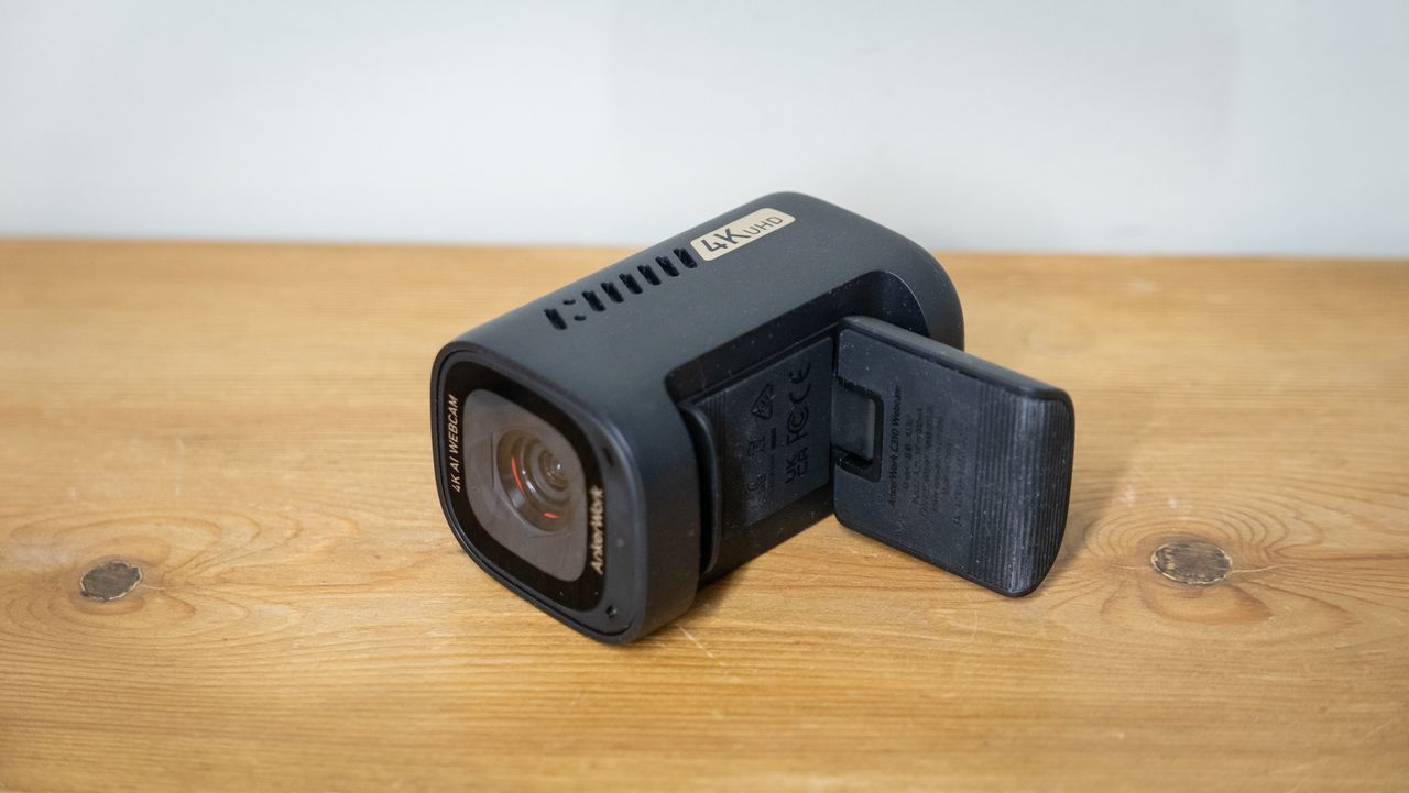 AnkerWork C310 webcam on a wooden surface