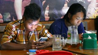 Smartphone addiction is spreading, with Myanmar having caught up with Western levels of penetration in less than two year. Image credit: © Jamie Carter