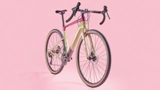 Cannondale Topstone carbon three on pink background