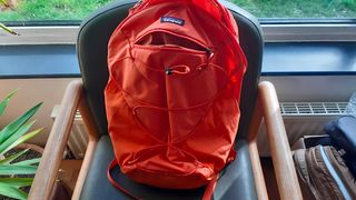 The Patagonia Altvia Daypack with the front pocket unzipped