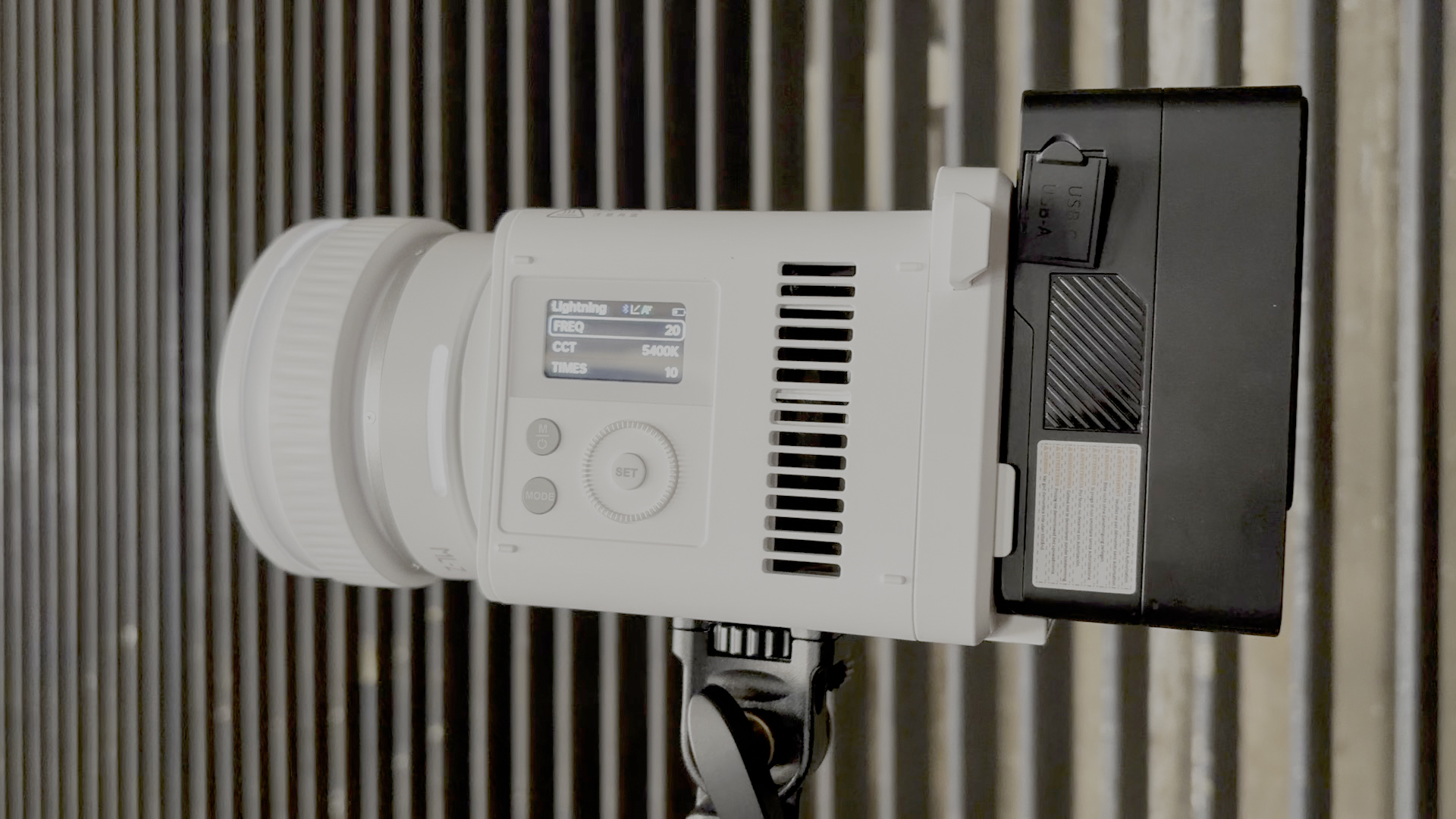 Shot of the side of the ML150Bi showing a close-up of the LCD screen, mode buttons, and the control dial.