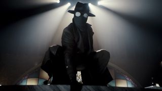 Nicolas Cage's The Spider crouched down in Spider-Noir