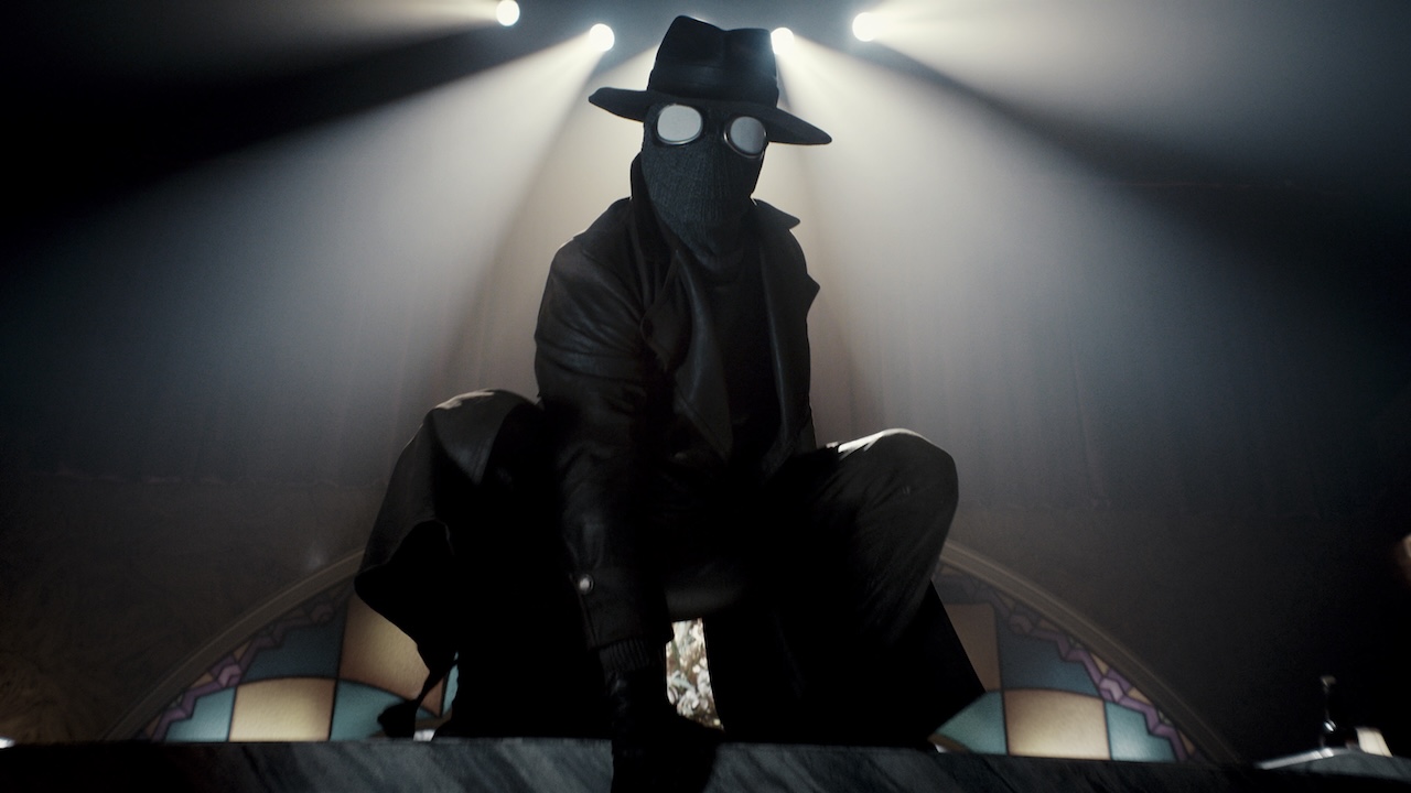 Nicolas Cage's The Spider crouched down in Spider-Noir