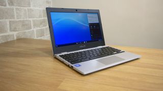 A photograph of the Asus Chromebook CX1 open on a table