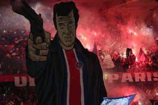 Paris Saint-Germain ultras with a giant tifo depicting actor Jean-Paul Belmondo ahead of their Champions League clash against AC Milan in October 2023.