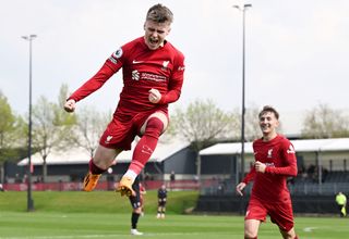 Ben Doak of Liverpool celebrates scoring Liverpool's first goal during the PL2 game at AXA Training Centre on April 22, 2023 in Kirkby, England.