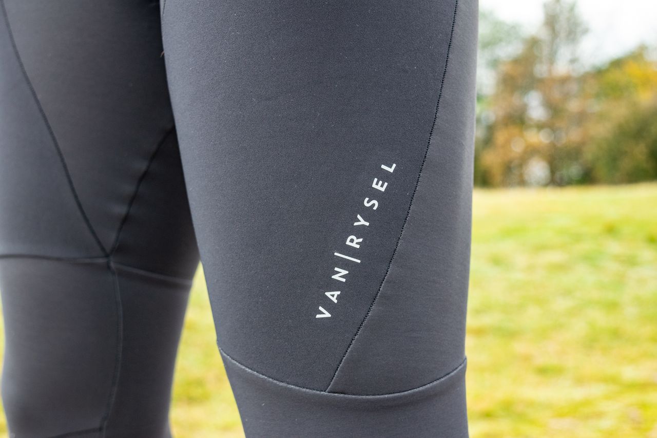 A Van Rysel logo on a pair of black bibtights