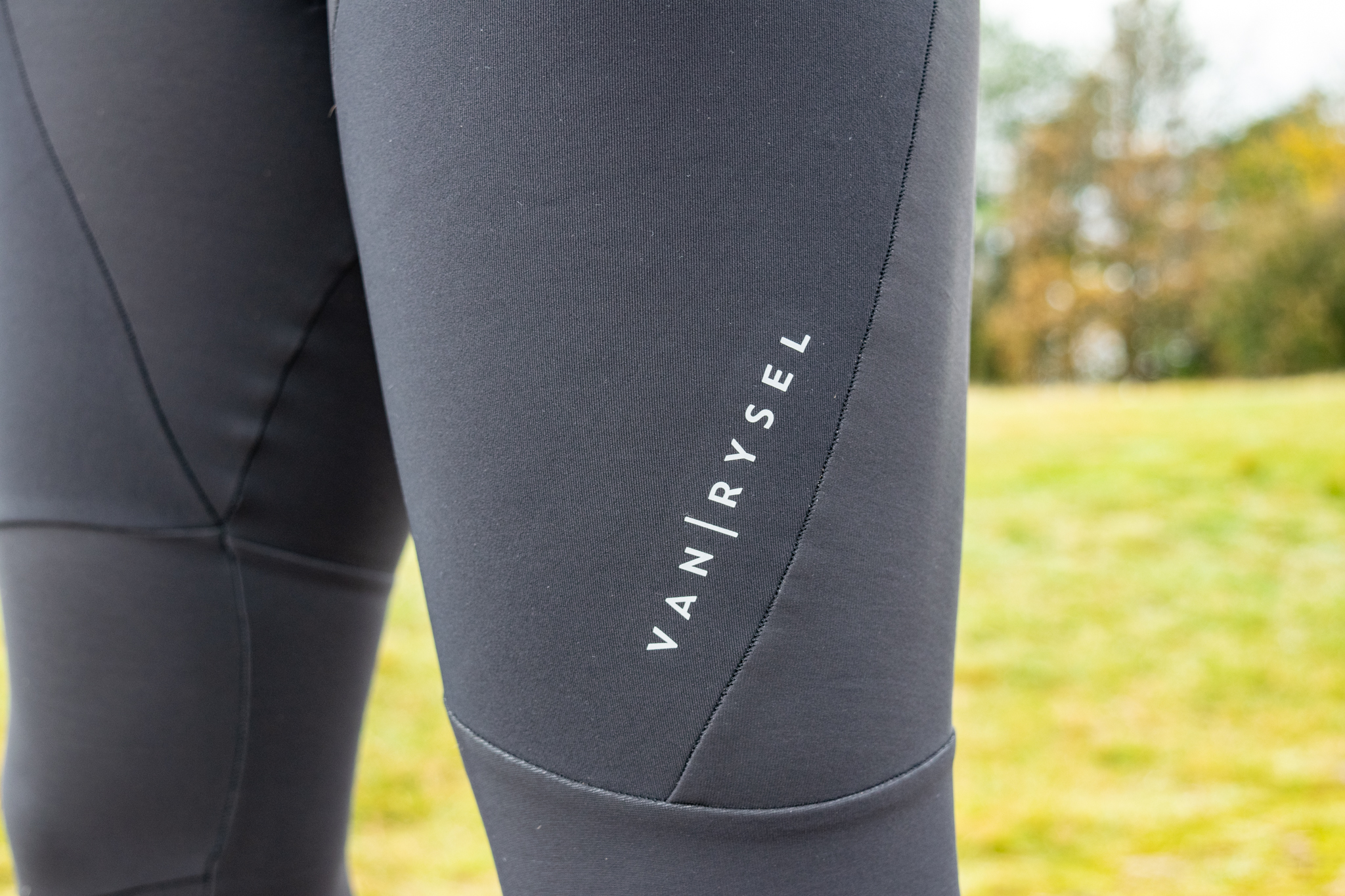 A Van Rysel logo on a pair of black bibtights 