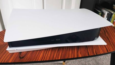 PS5 console on a wooden table