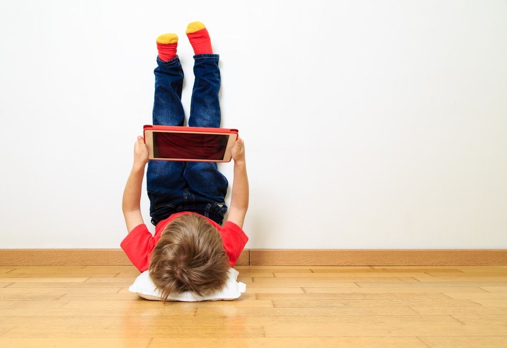 young boy on ipad