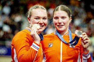 Lisa van Belle (R) shares the podium at the Paris Olympic Games with Maike van der Duin, as the duo earned bronze in the women's Madison 