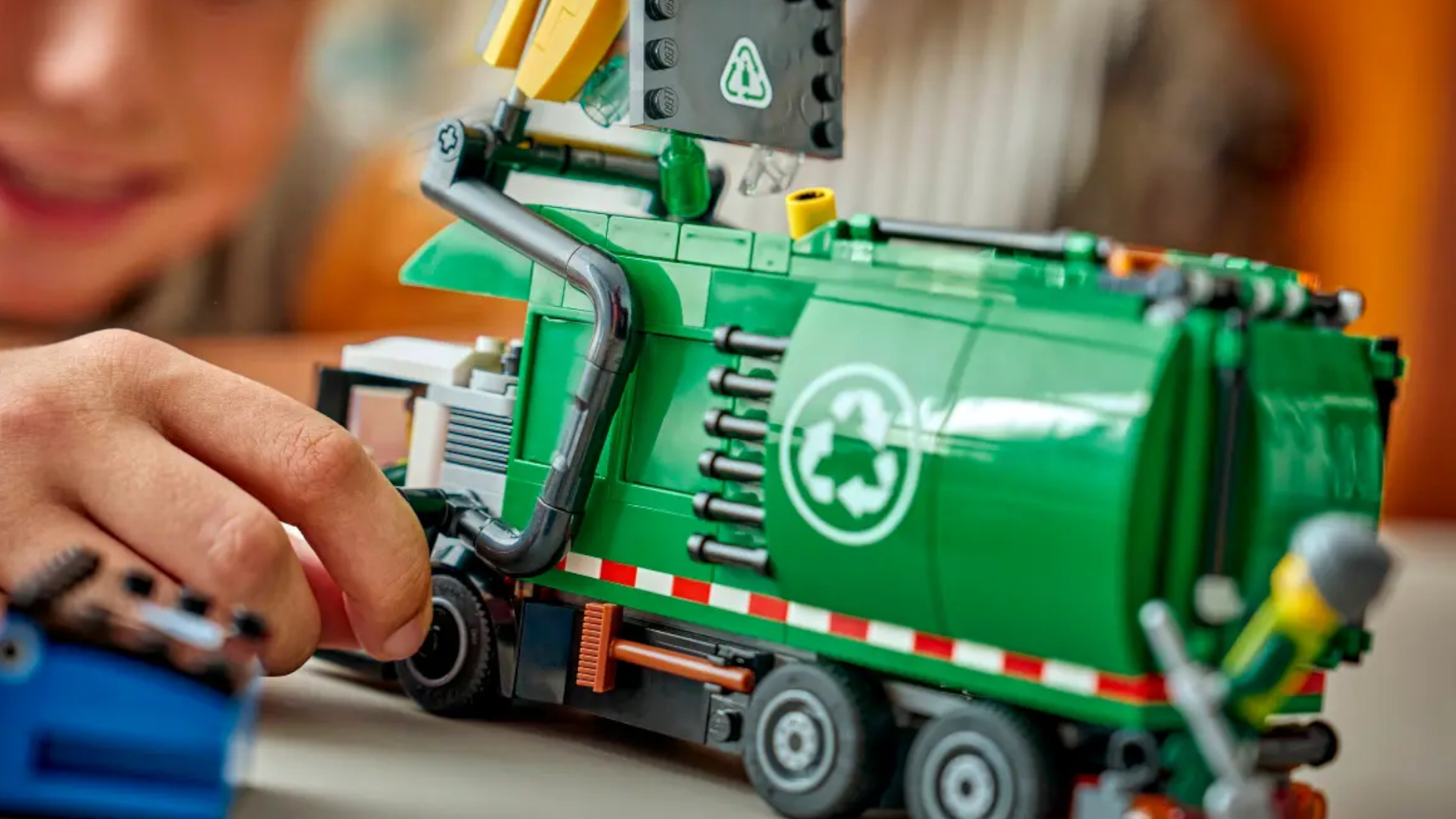 A child plays with the Lego Recycling Truck