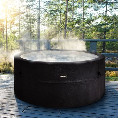 Wave Osaka 6-Person Hot Tub on decking with trees behind