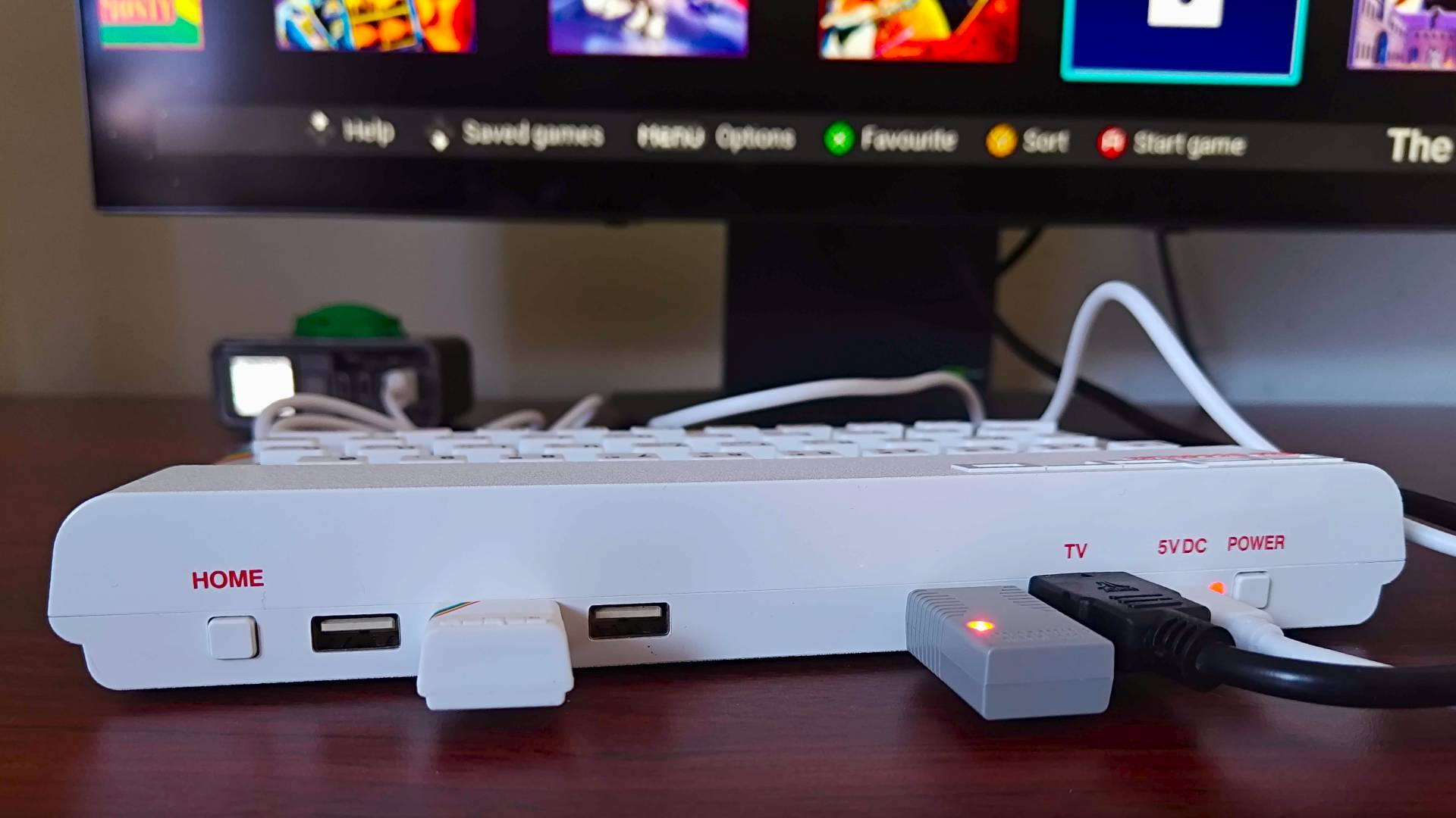 The Spectrum White Edition with HDMI, USB controller receiver, Microdrive, and power connected to back.