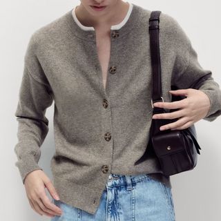 Image of woman wearing brown cardigan 